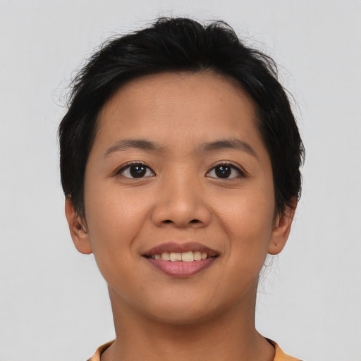 Joyful asian young-adult female with short  brown hair and brown eyes