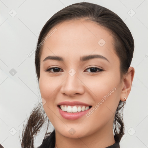 Joyful white young-adult female with long  brown hair and brown eyes