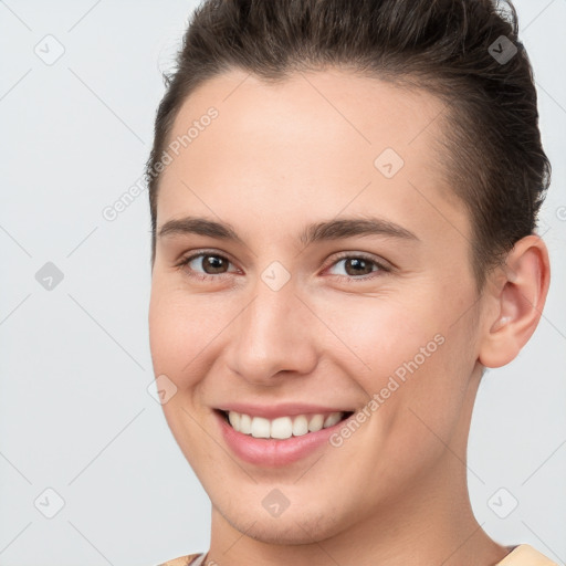 Joyful white young-adult female with short  brown hair and brown eyes