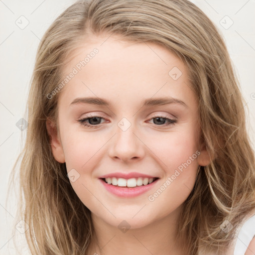 Joyful white young-adult female with long  brown hair and blue eyes