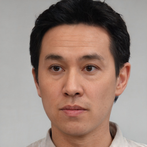 Neutral asian adult male with short  black hair and brown eyes