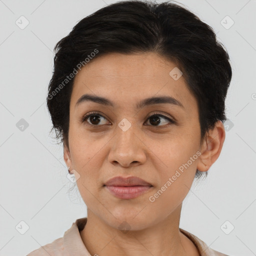 Joyful latino young-adult female with short  brown hair and brown eyes