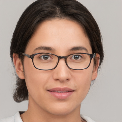 Joyful white young-adult female with medium  brown hair and brown eyes