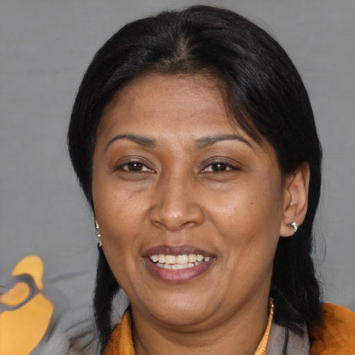 Joyful asian adult female with medium  brown hair and brown eyes