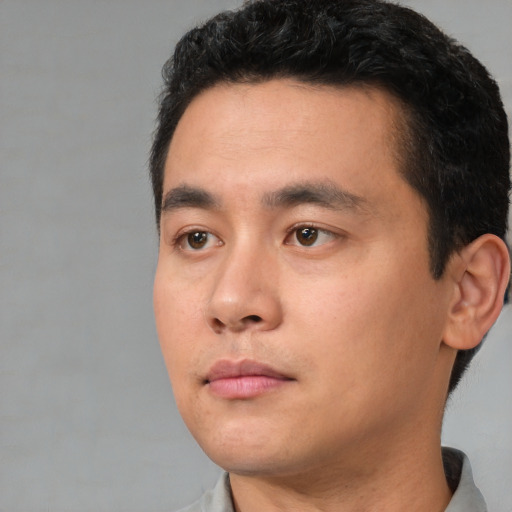 Neutral white young-adult male with short  black hair and brown eyes