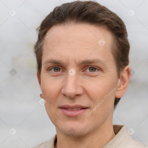 Joyful white adult male with short  brown hair and grey eyes