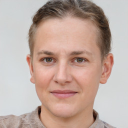 Joyful white adult male with short  brown hair and grey eyes