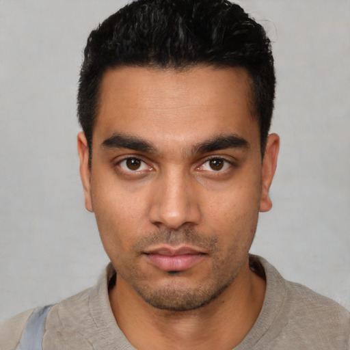 Neutral latino young-adult male with short  black hair and brown eyes