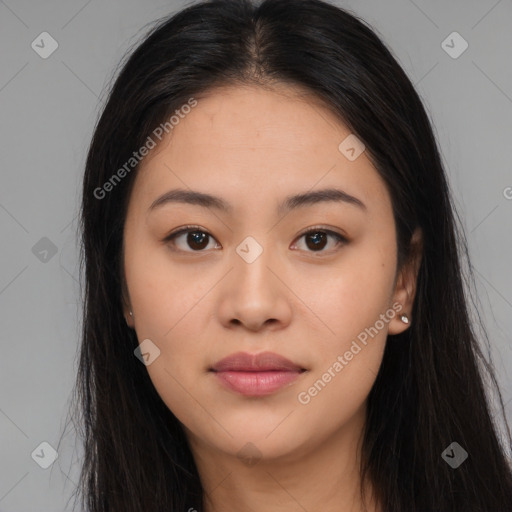 Joyful asian young-adult female with long  brown hair and brown eyes