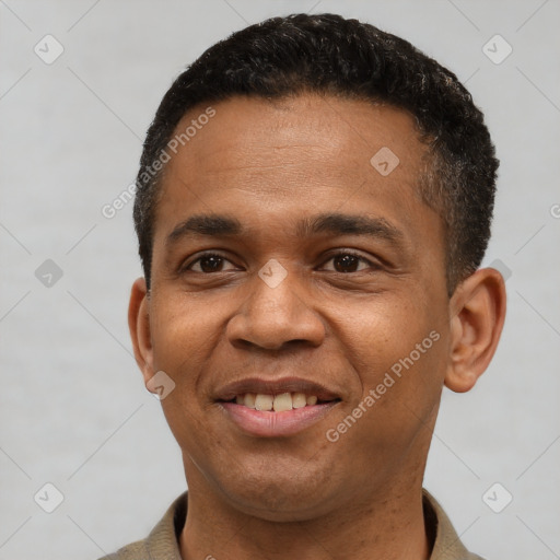Joyful latino young-adult male with short  black hair and brown eyes