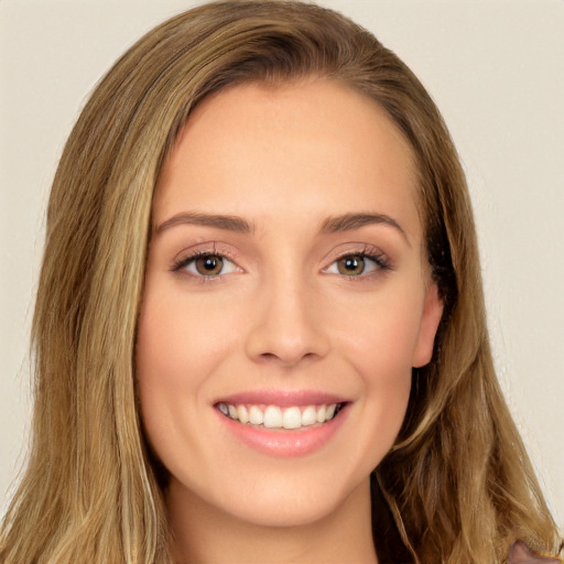 Joyful white young-adult female with long  brown hair and brown eyes