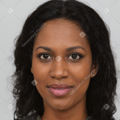 Joyful black young-adult female with long  brown hair and brown eyes