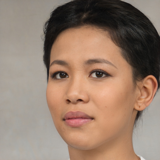 Neutral asian young-adult female with short  brown hair and brown eyes