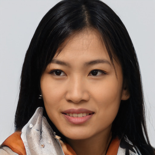 Joyful asian young-adult female with long  black hair and brown eyes