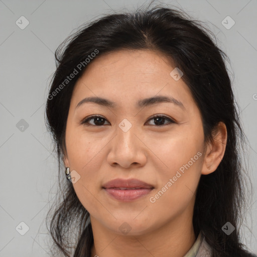 Joyful asian adult female with medium  brown hair and brown eyes