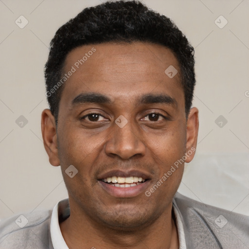 Joyful black young-adult male with short  black hair and brown eyes