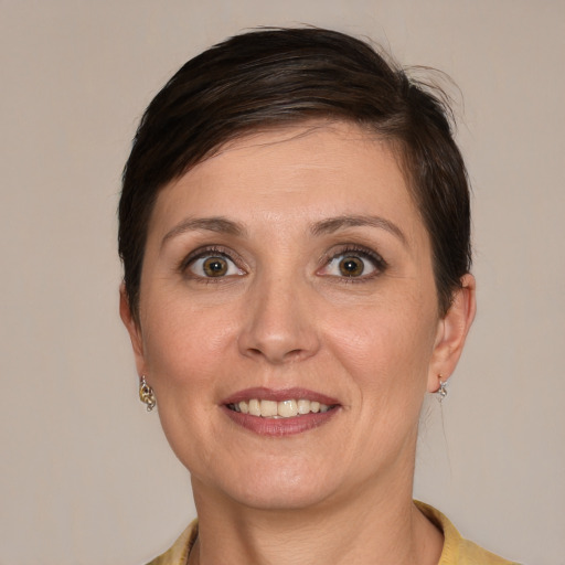 Joyful white young-adult female with short  brown hair and brown eyes