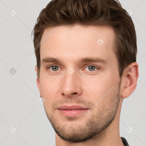 Neutral white young-adult male with short  brown hair and grey eyes