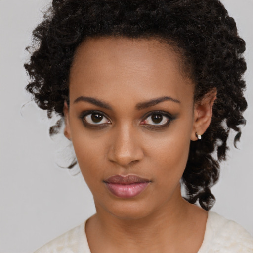 Neutral black young-adult female with medium  black hair and brown eyes