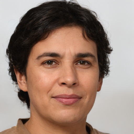 Joyful white adult male with medium  brown hair and brown eyes