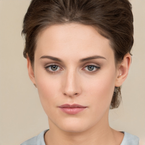 Neutral white young-adult female with short  brown hair and brown eyes