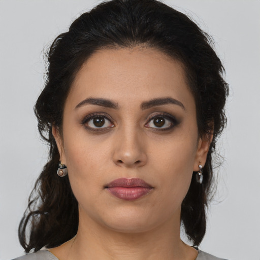 Neutral latino young-adult female with long  brown hair and brown eyes