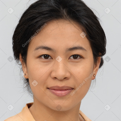 Joyful asian young-adult female with medium  brown hair and brown eyes