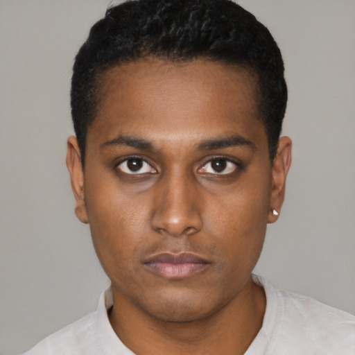 Neutral latino young-adult male with short  black hair and brown eyes