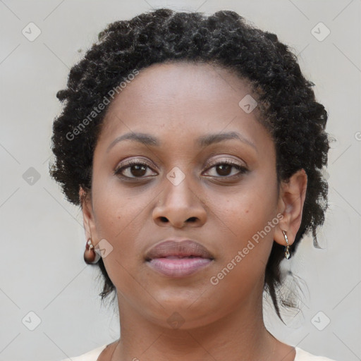 Neutral black young-adult female with long  brown hair and brown eyes