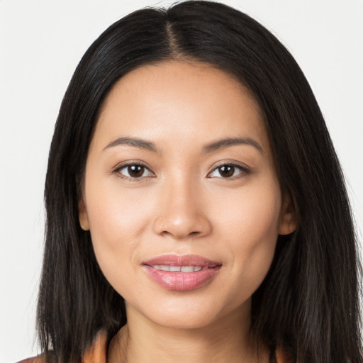 Joyful latino young-adult female with long  brown hair and brown eyes