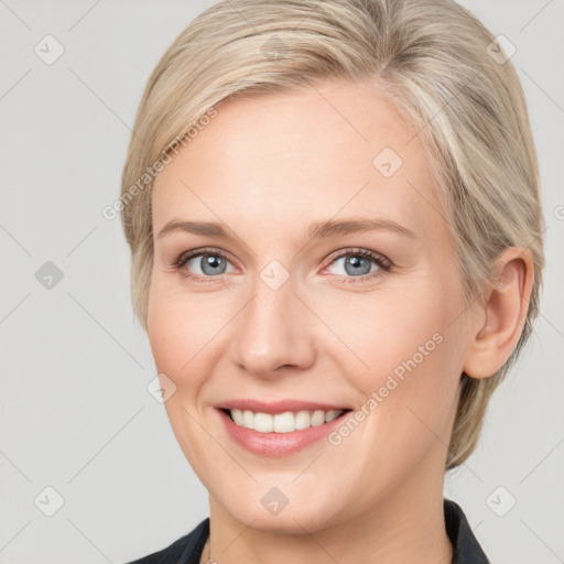 Joyful white young-adult female with medium  brown hair and blue eyes