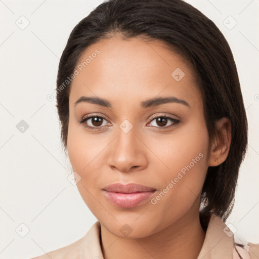 Joyful latino young-adult female with medium  brown hair and brown eyes