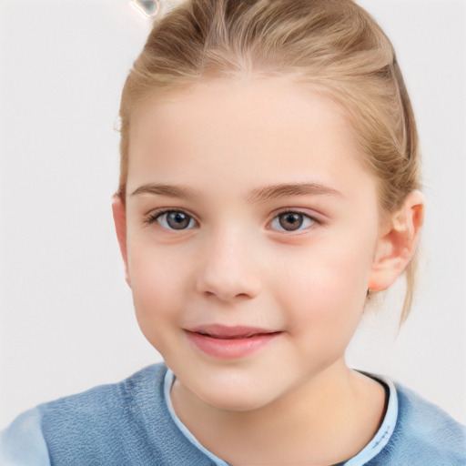 Joyful white child female with short  brown hair and grey eyes