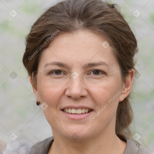 Joyful white adult female with short  brown hair and grey eyes