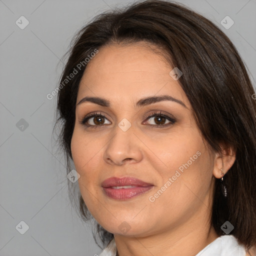 Joyful white adult female with medium  brown hair and brown eyes