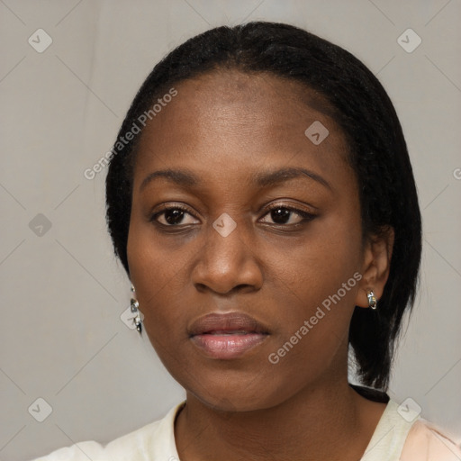 Neutral black young-adult female with medium  black hair and brown eyes