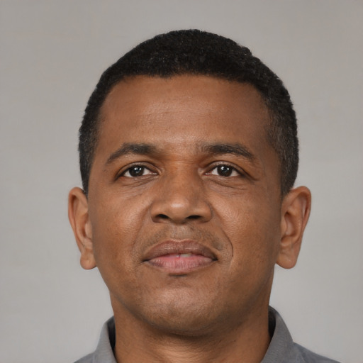 Neutral black adult male with short  black hair and brown eyes