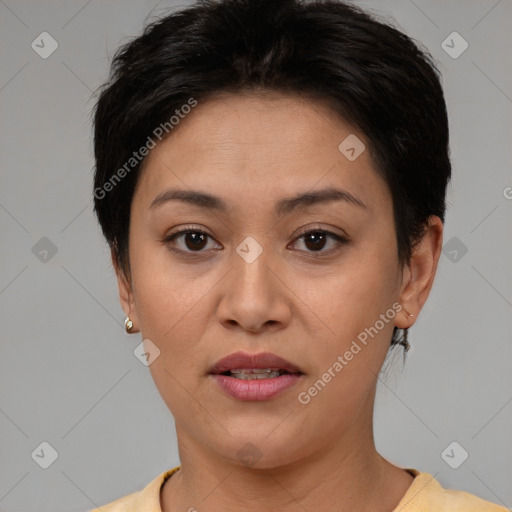 Joyful white adult female with short  brown hair and brown eyes