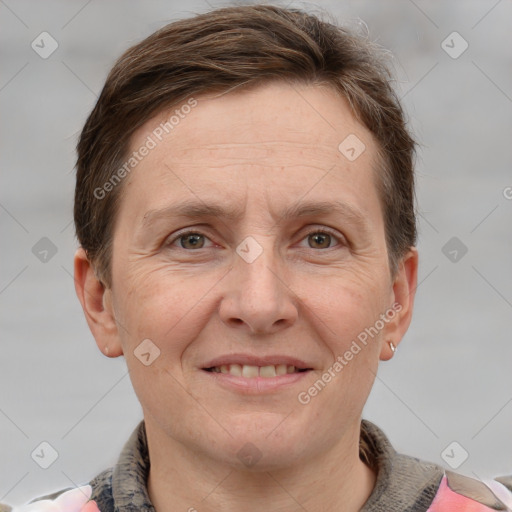 Joyful white adult male with short  brown hair and grey eyes