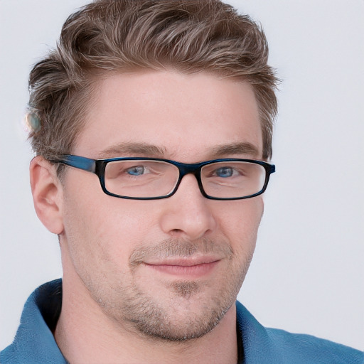 Joyful white young-adult male with short  brown hair and blue eyes