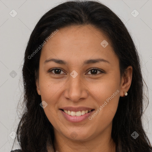 Joyful latino young-adult female with long  brown hair and brown eyes