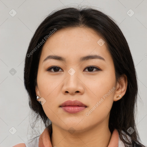 Neutral asian young-adult female with medium  brown hair and brown eyes