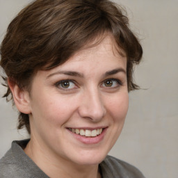 Joyful white adult female with medium  brown hair and grey eyes