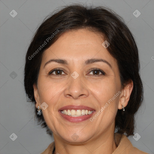 Joyful white adult female with medium  brown hair and brown eyes