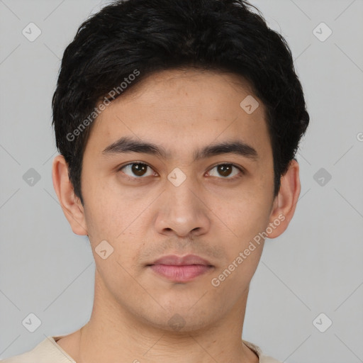 Joyful latino young-adult male with short  brown hair and brown eyes