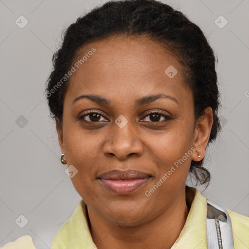 Joyful black adult female with short  brown hair and brown eyes