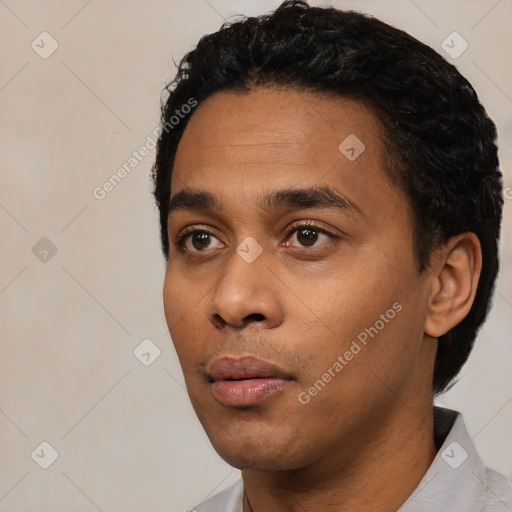 Neutral latino young-adult male with short  black hair and brown eyes