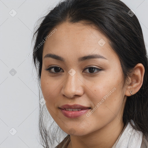 Joyful latino young-adult female with long  brown hair and brown eyes