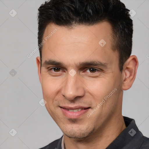 Joyful white adult male with short  brown hair and brown eyes