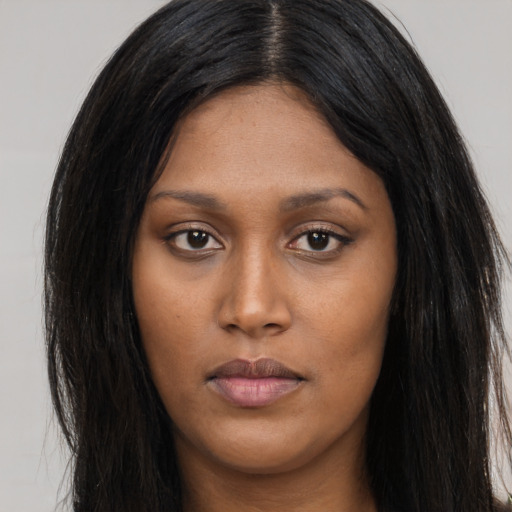 Joyful asian young-adult female with long  brown hair and brown eyes